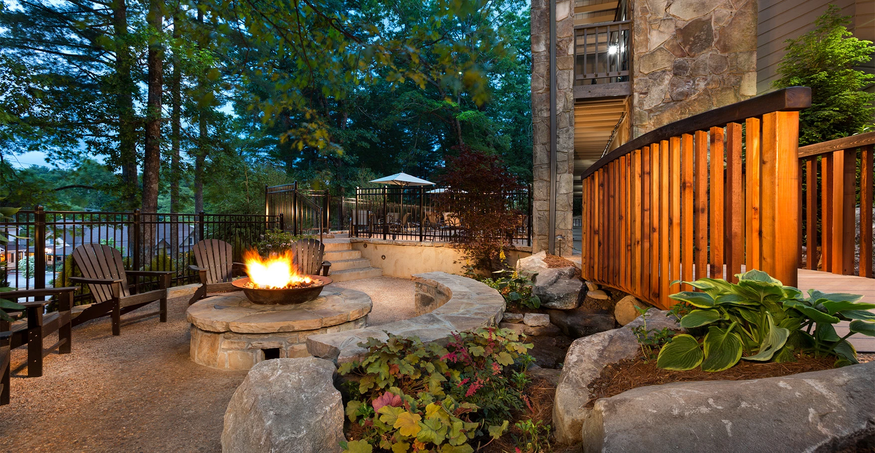 a fire pit with a fire in the middle of a building