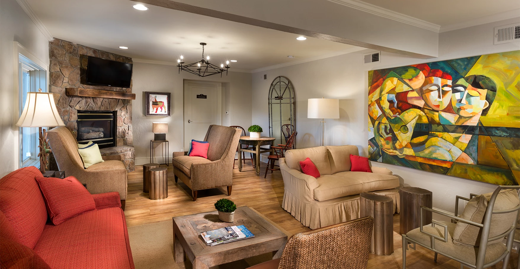 a living room with a couch and chairs