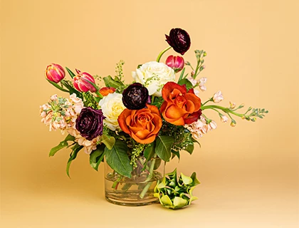 a bouquet of flowers in a glass vase