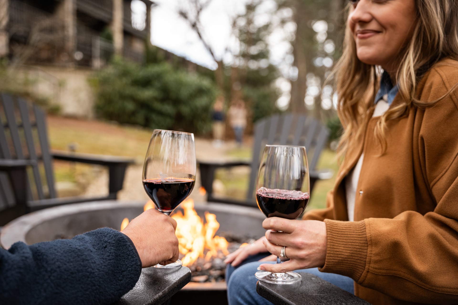 a couple of people holding wine glasses