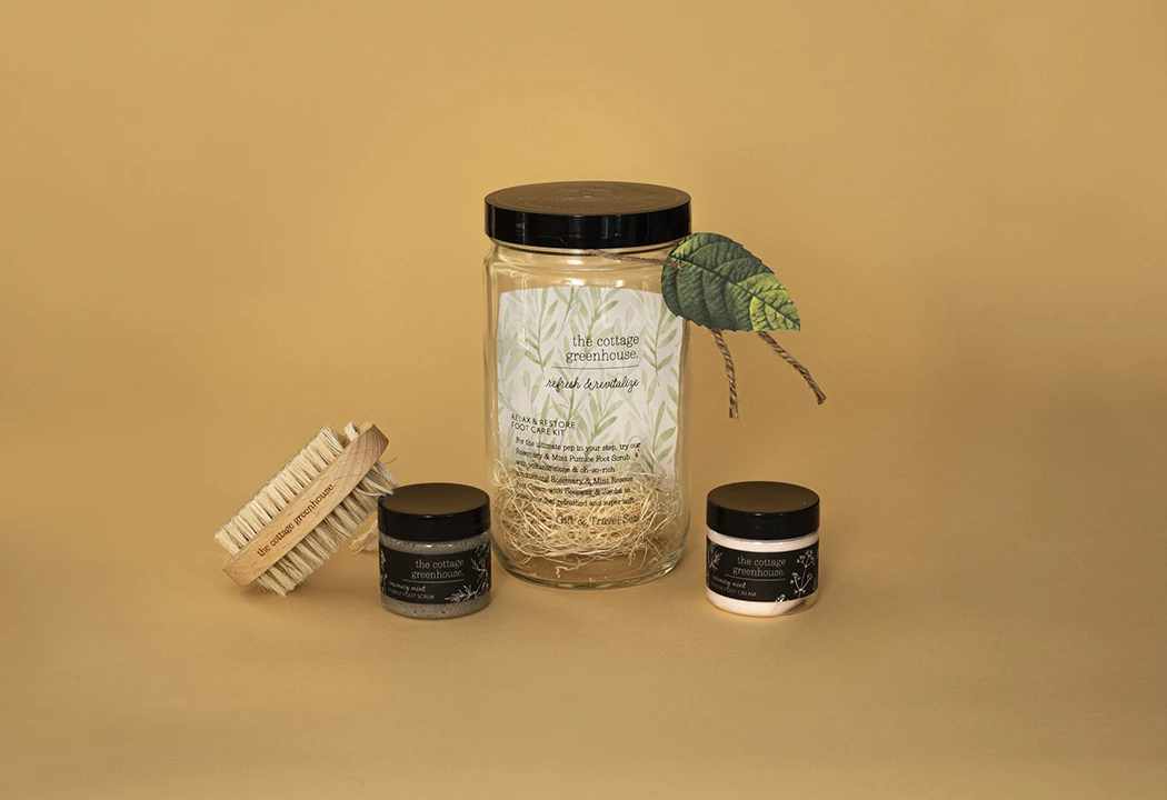 a group of jars with a brush and a label