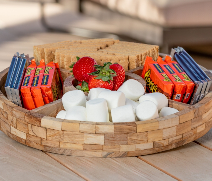 a tray of marshmallows and strawberries