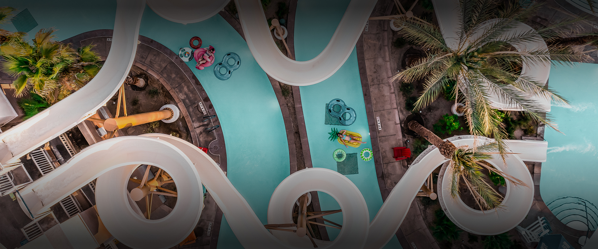 a water park with a slide and people