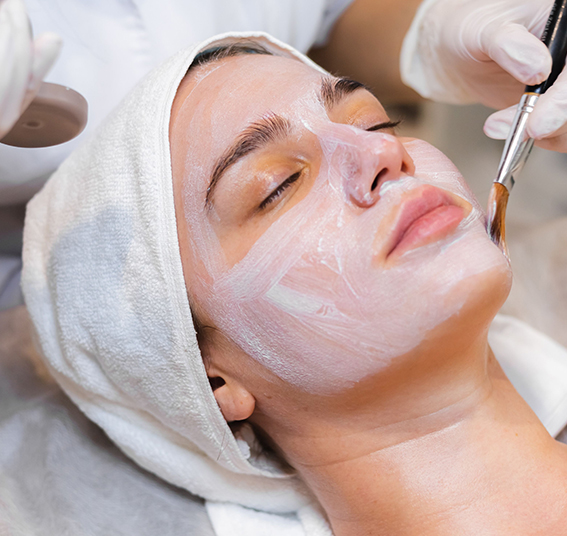 a woman with a white mask on her face