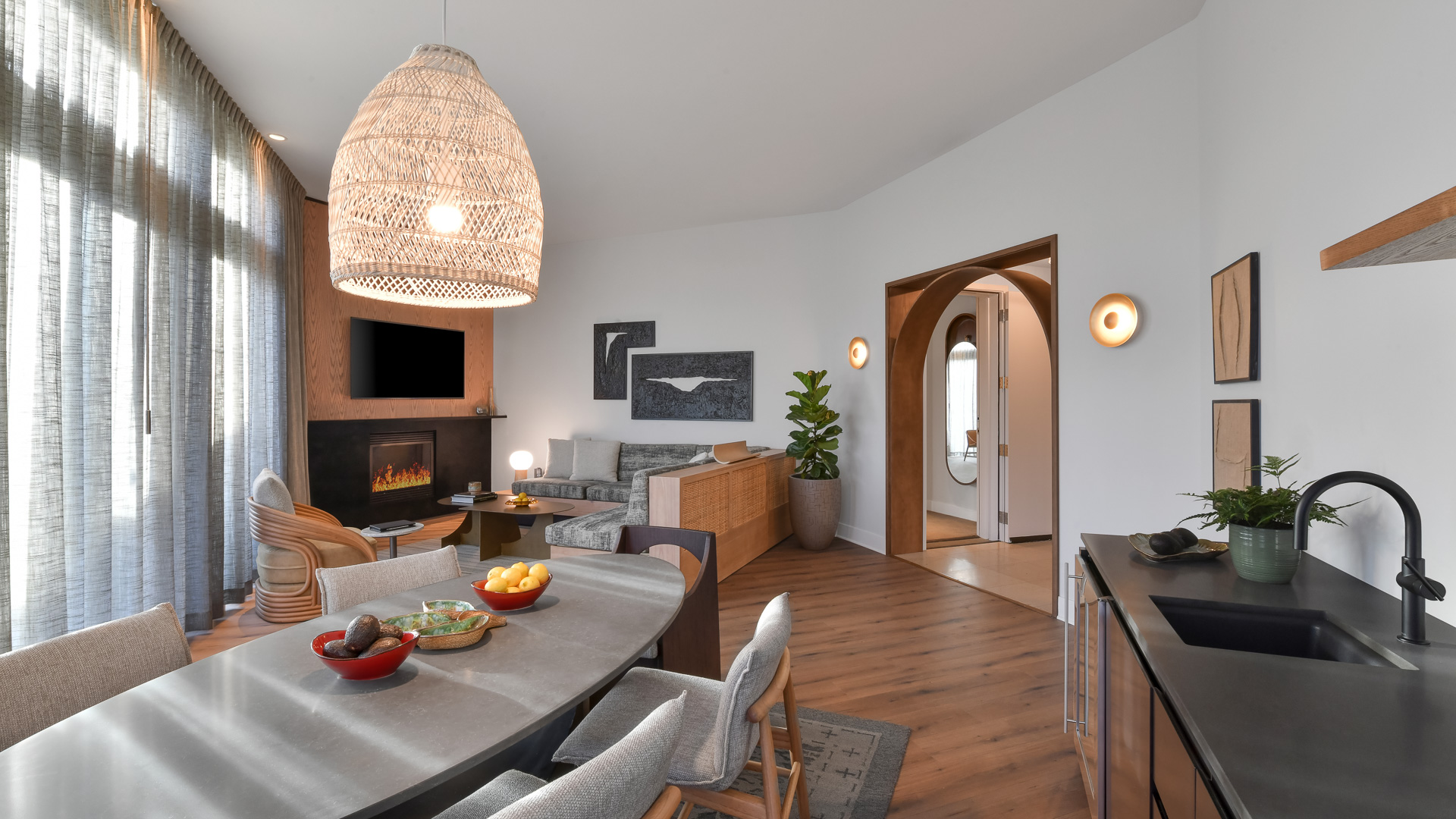 a living room with a table and chairs