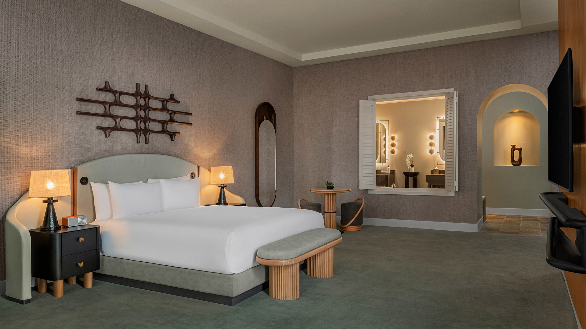 a room with a bed and a mirror