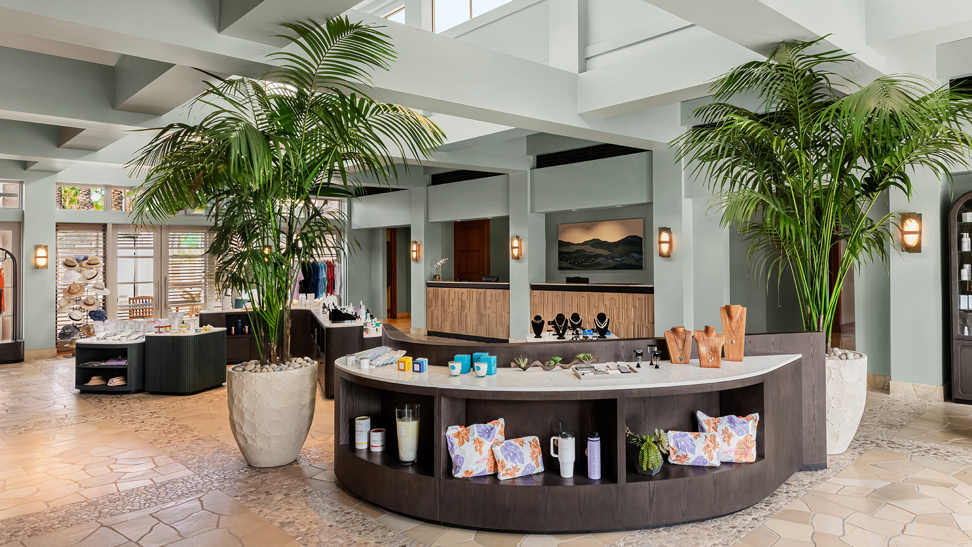 a room with a counter and palm trees