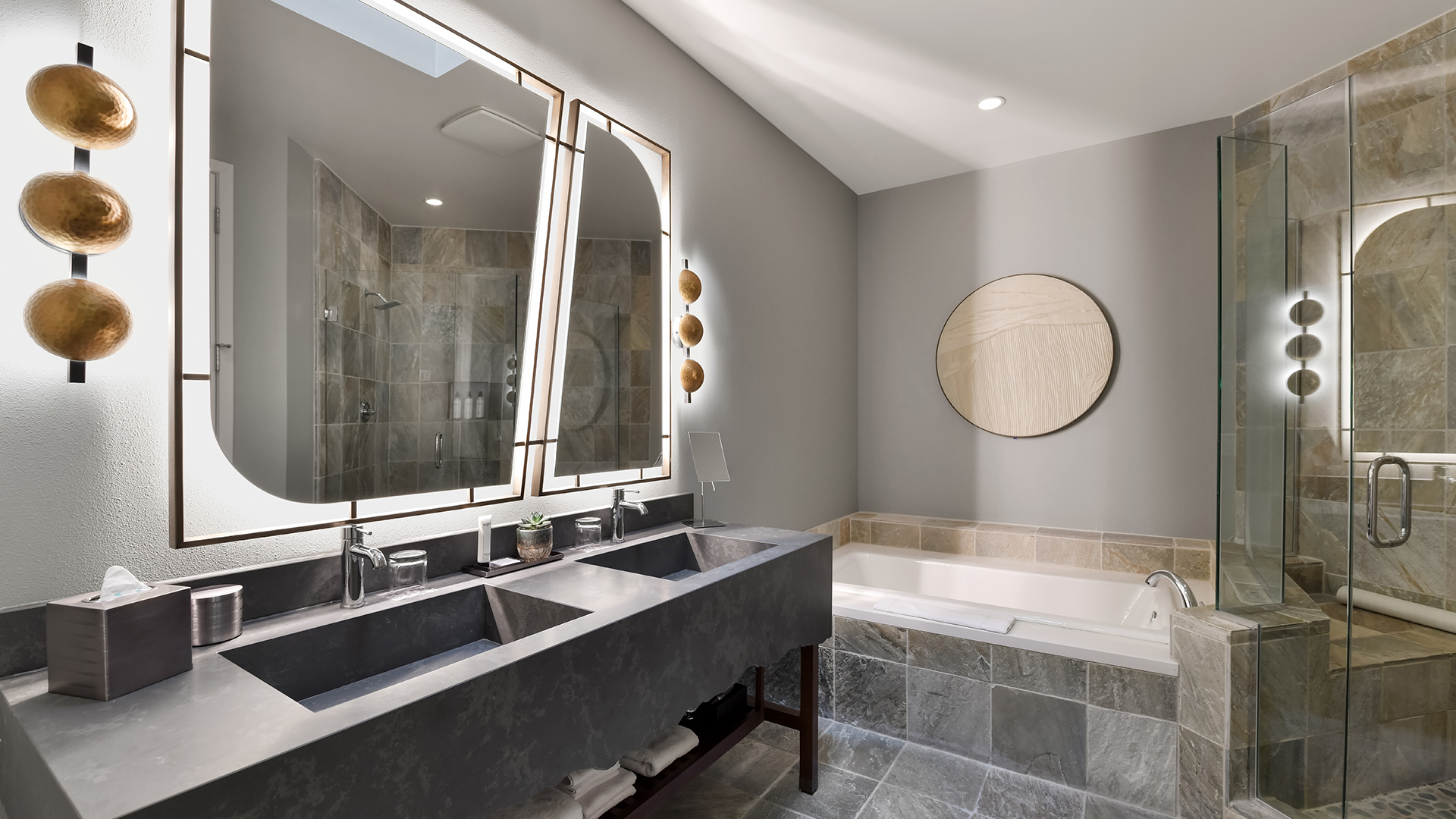 a bathroom with a large mirror and a tub