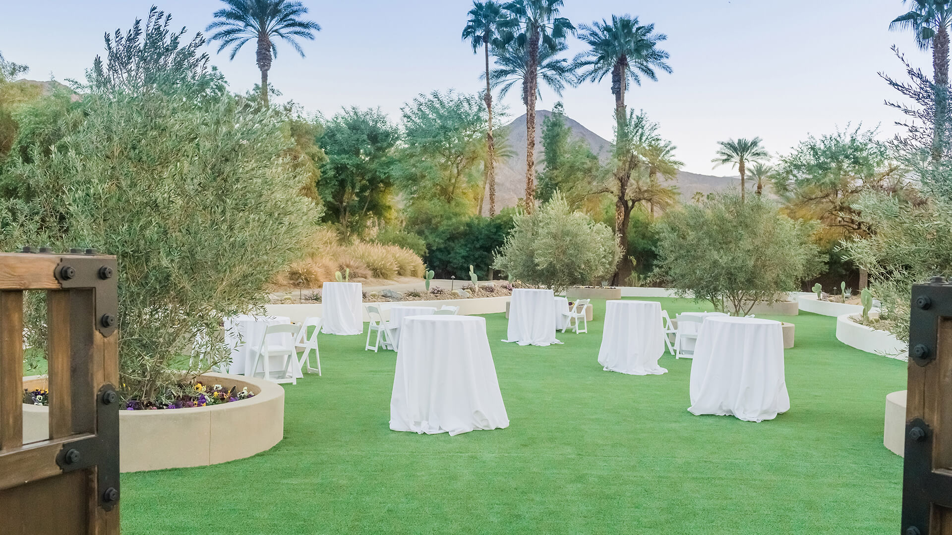 a group of tables covered in white cloths