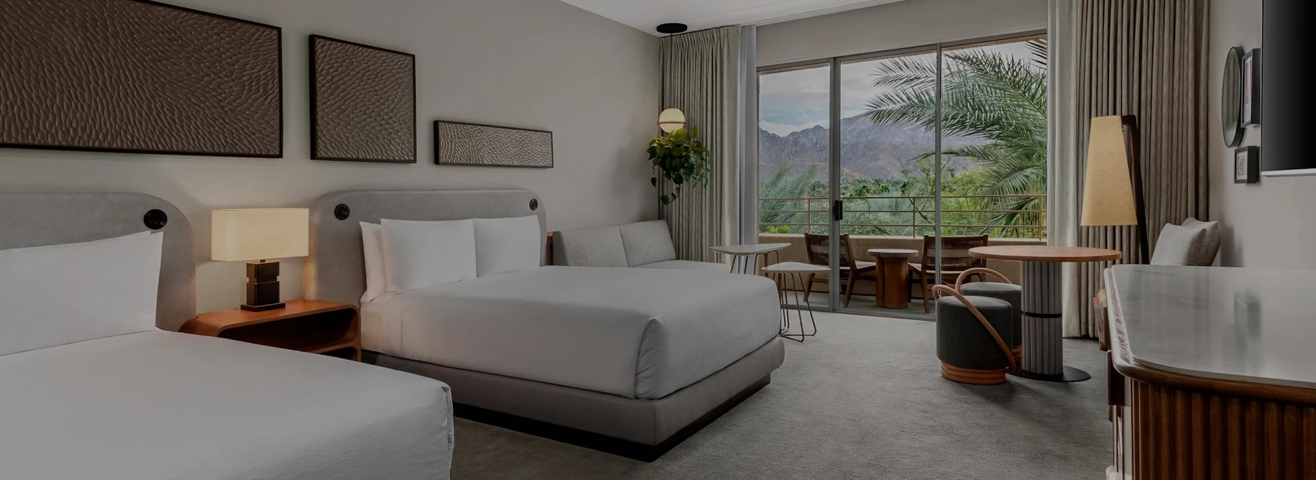 a bedroom with a large bed and a balcony