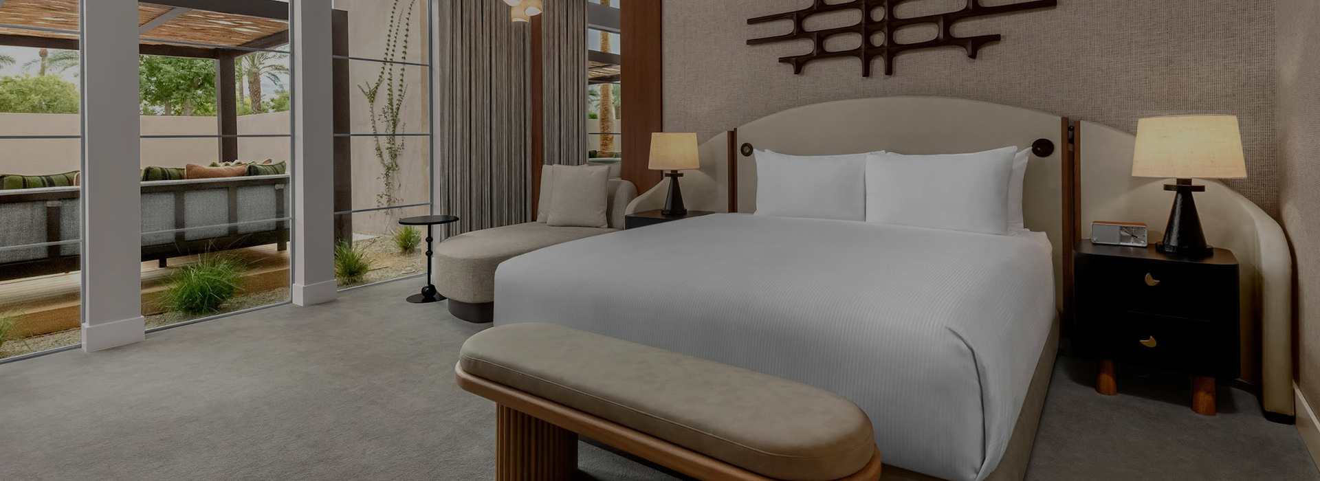 a bed with a bench in a room