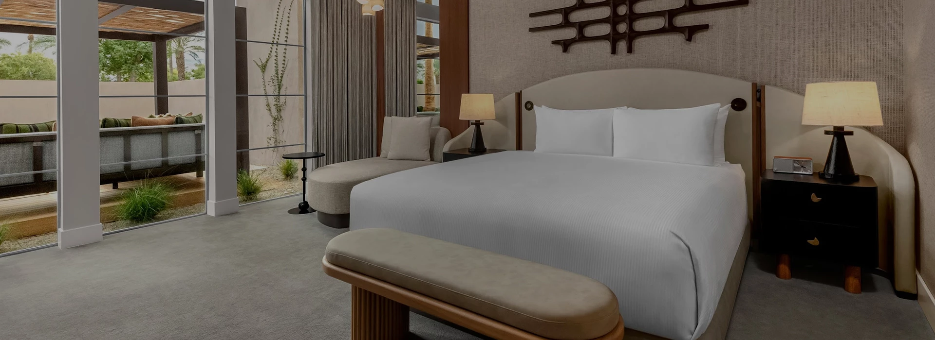 a bed with a bench in a room