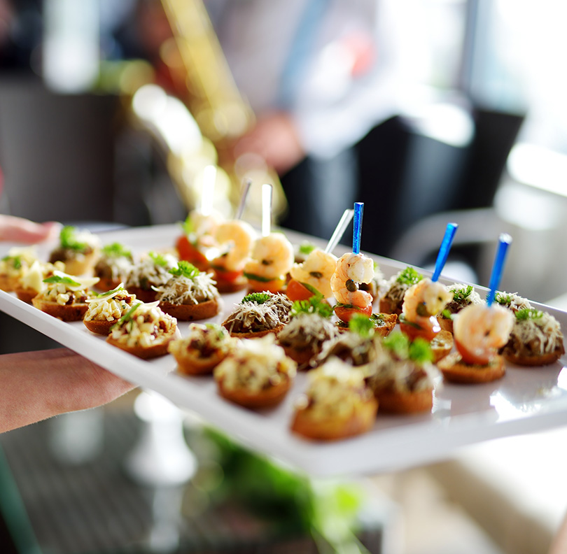 a person holding a plate of food