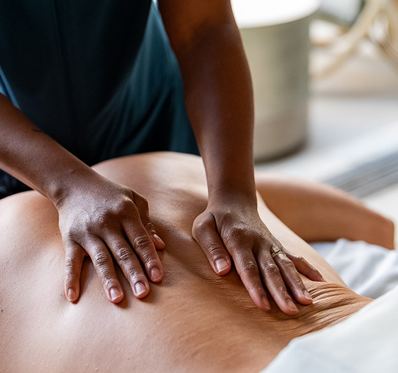 a person receiving a back massage