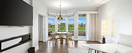 a room with a table and chairs