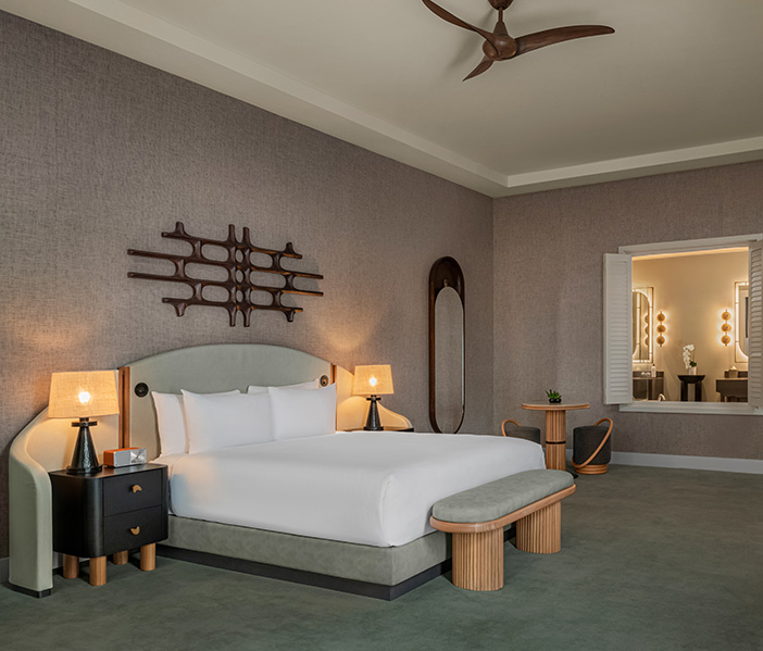 a room with a bed and a fan