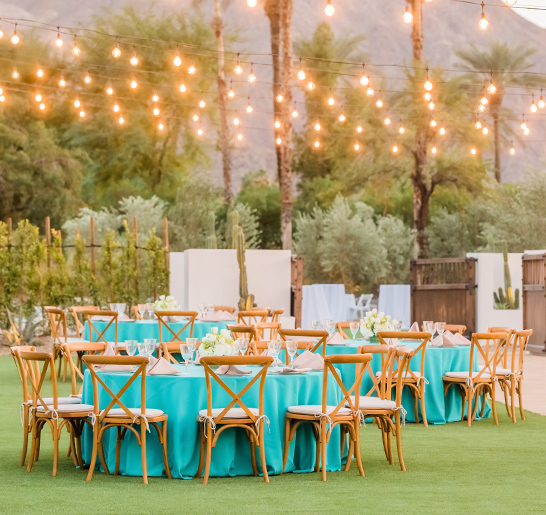 a group of tables and chairs in a yard