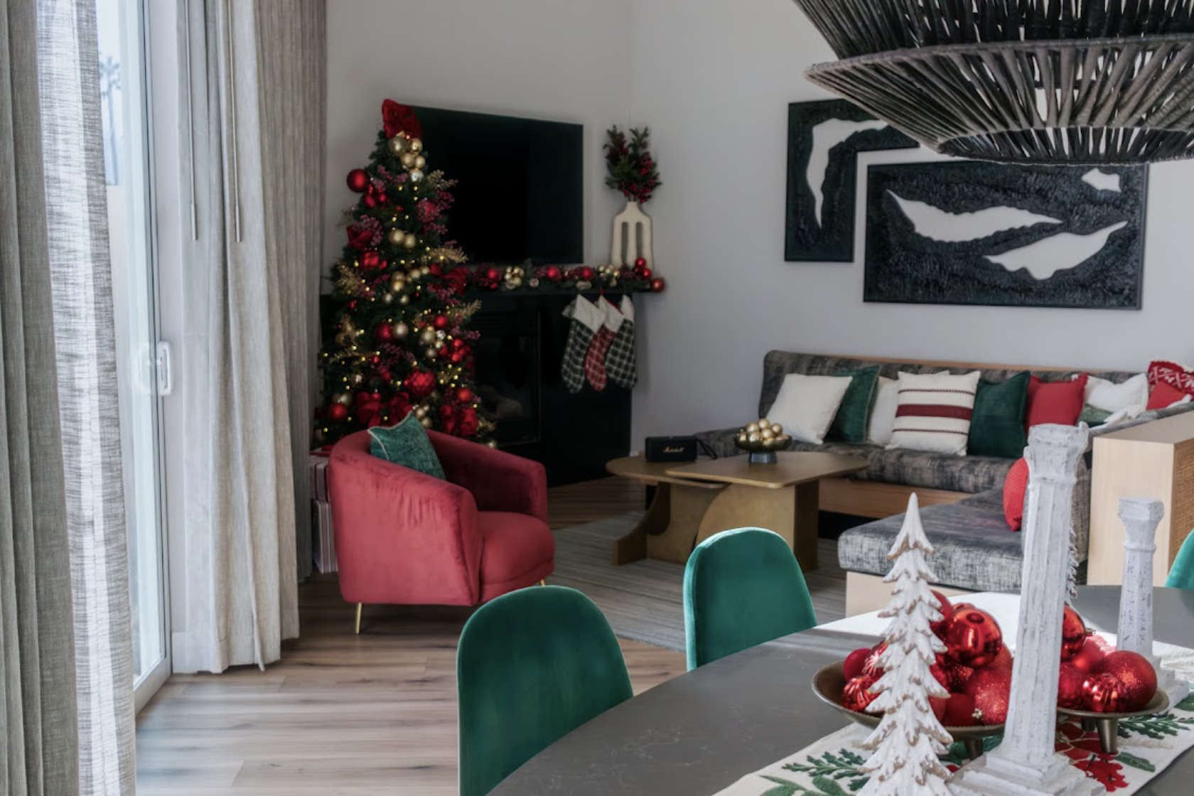 a living room with a christmas tree and a fireplace