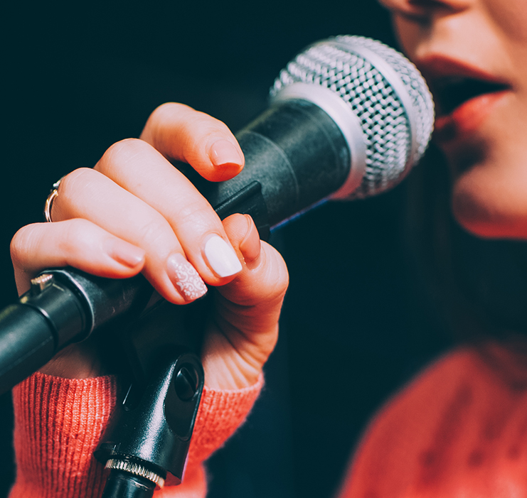a woman holding a microphone