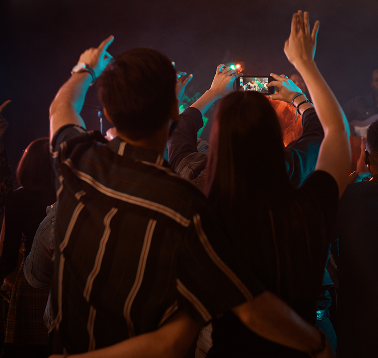 a group of people with their hands up
