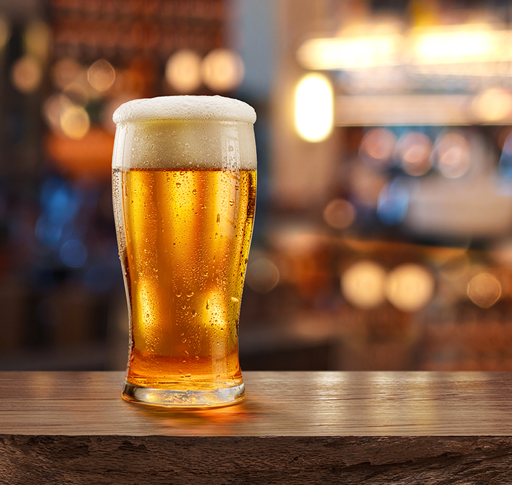 a glass of beer on a table
