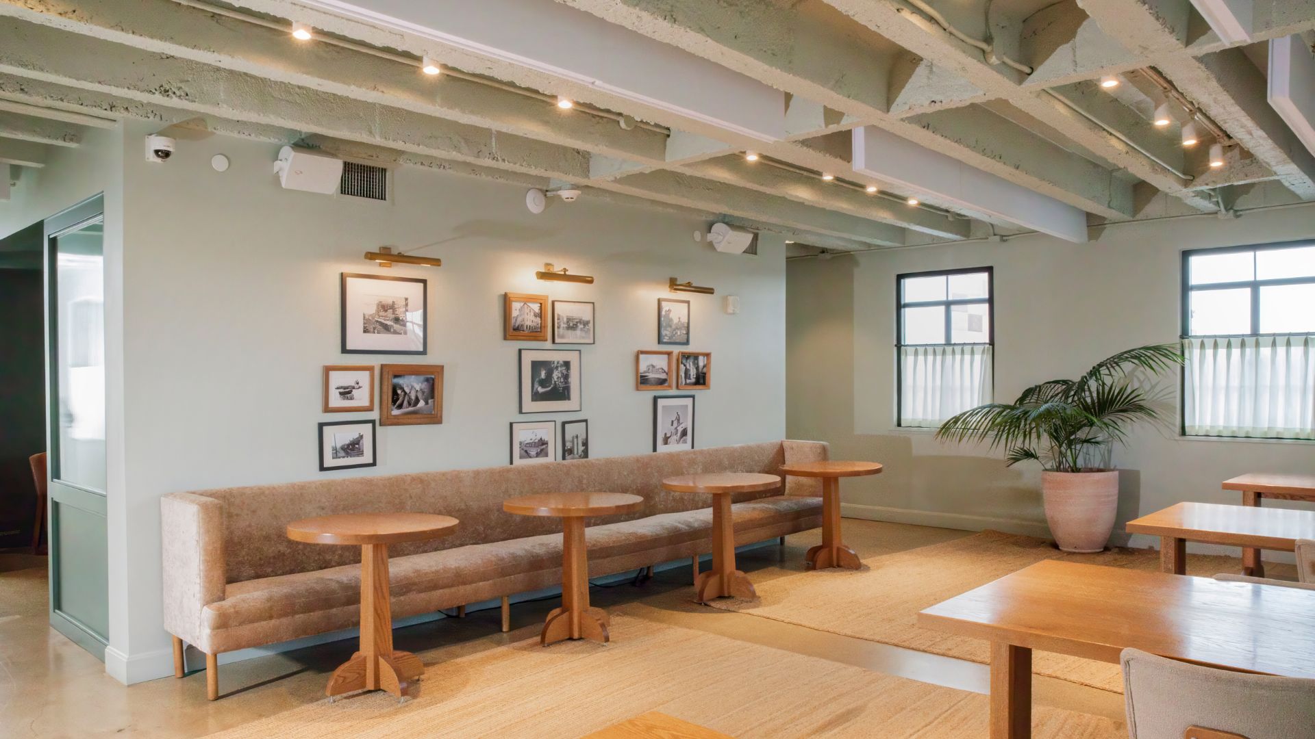 a room with a couch and tables