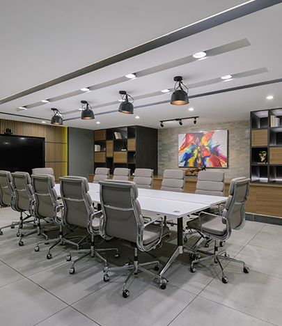 a conference room with a table and chairs