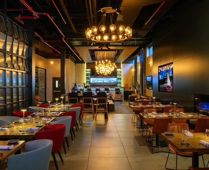 a dining area with tables and chairs