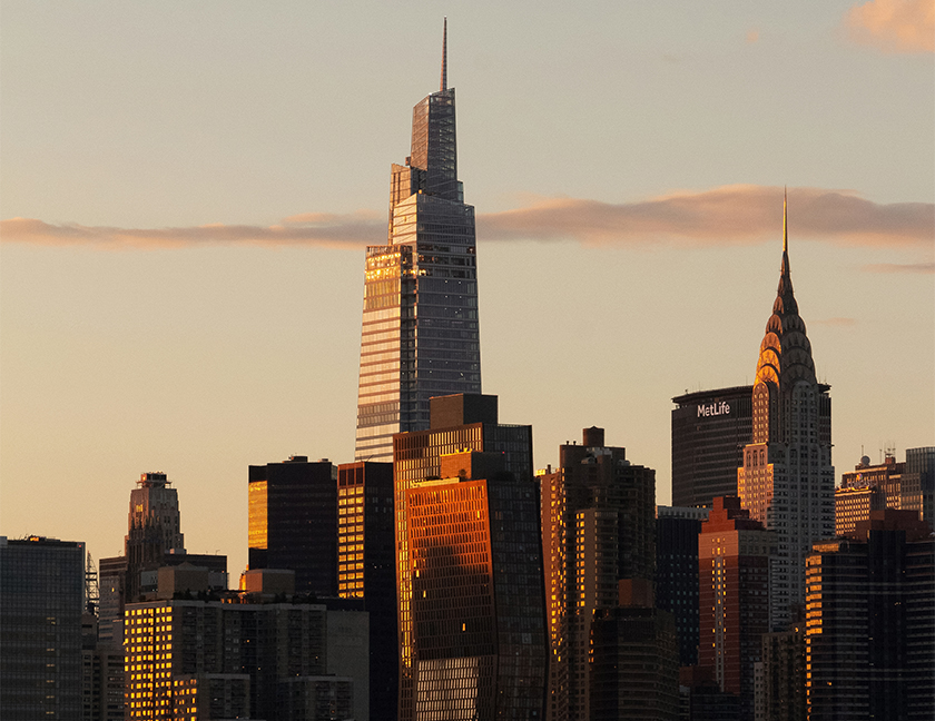 a city skyline with tall buildings