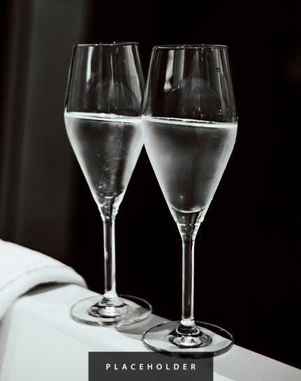 two glasses of champagne on a table