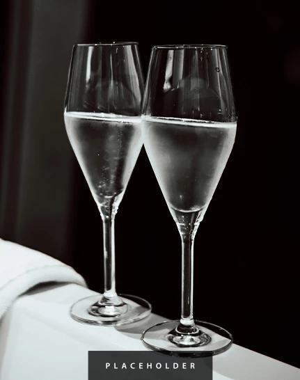 two glasses of champagne on a table