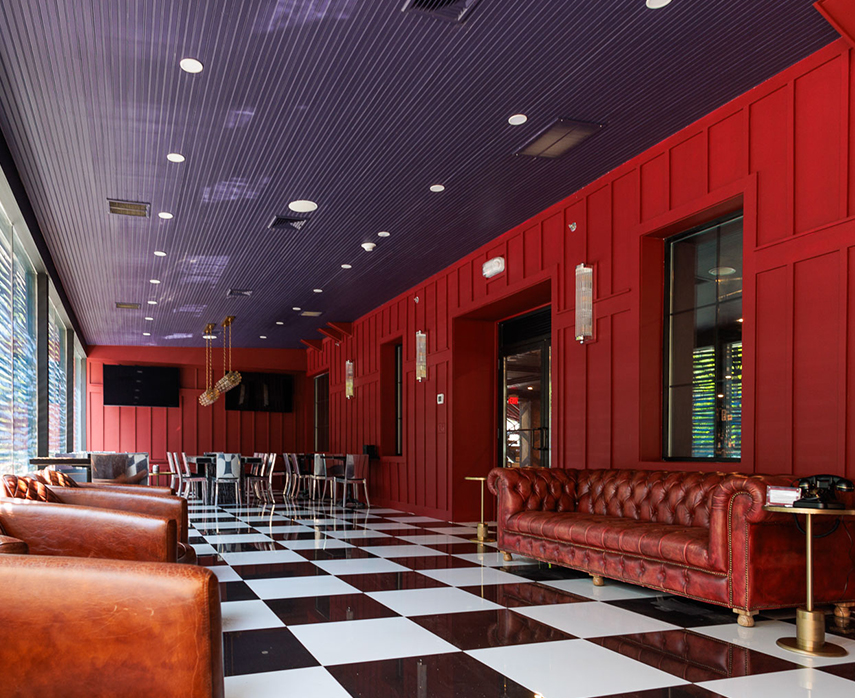a room with red walls and a checkered floor