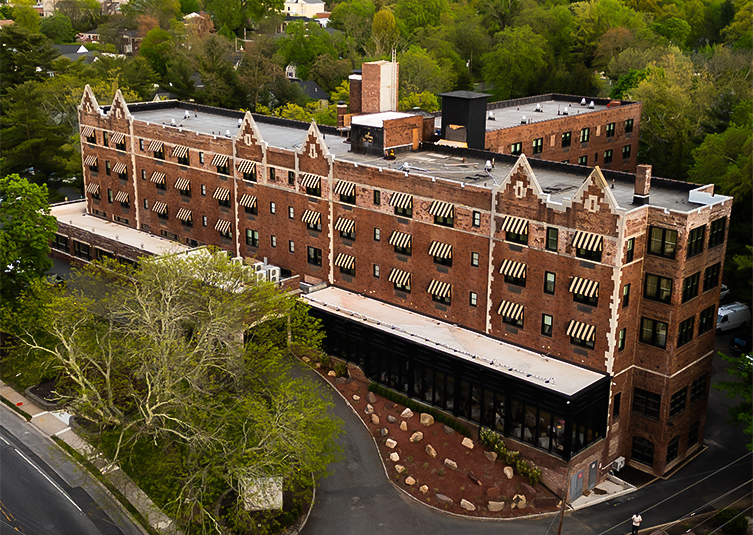 a building with trees in the background