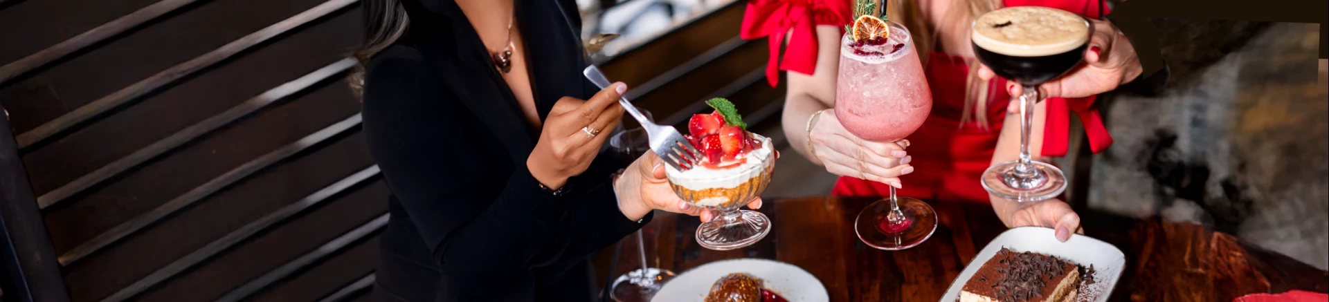 a person holding a fork over a dessert dish