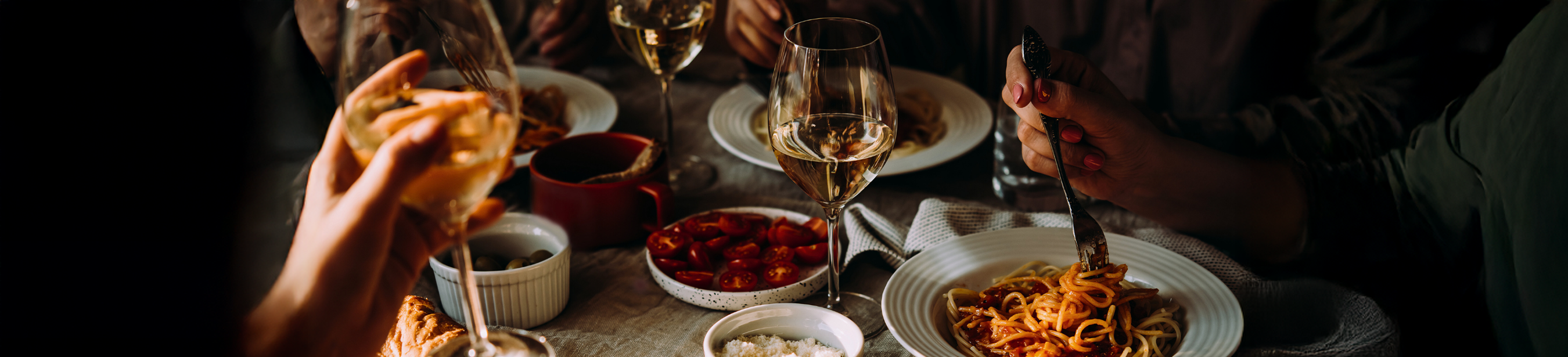 a glass of wine next to food