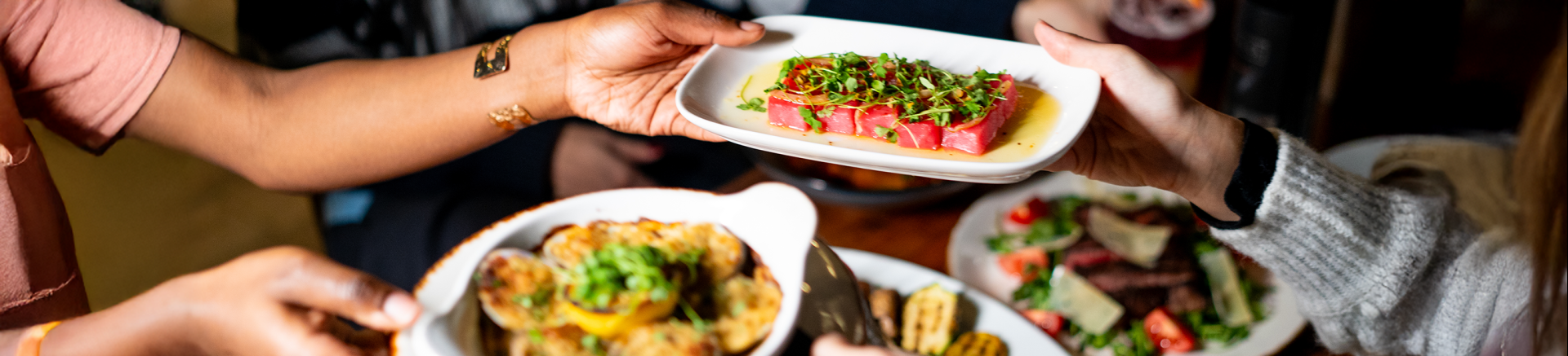 a person holding a plate of food