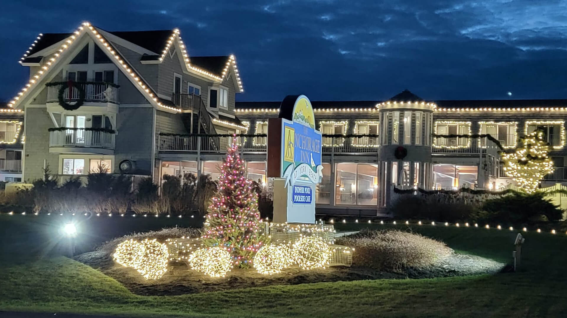 a house with a christmas tree in front of it