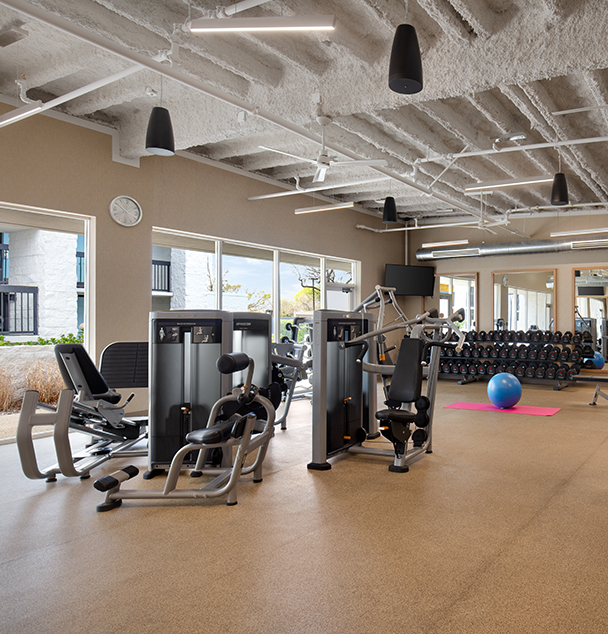 a large gym with exercise equipment