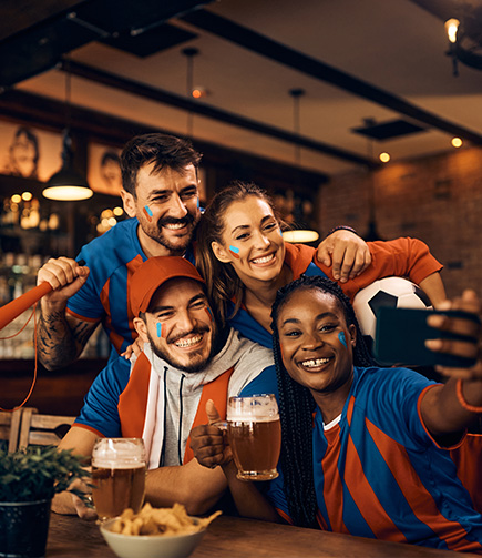 a group of people taking a selfie