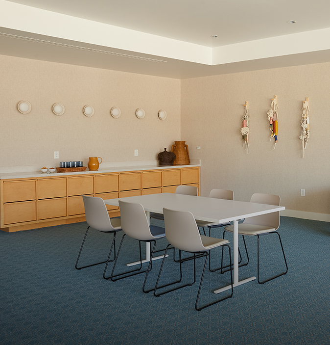 a room with a table and chairs