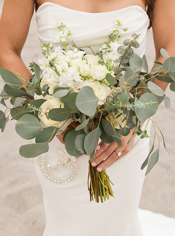 a woman holding a bouquet of flowers