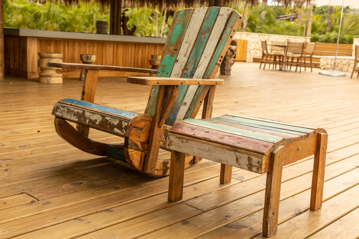 a wooden chair on a deck