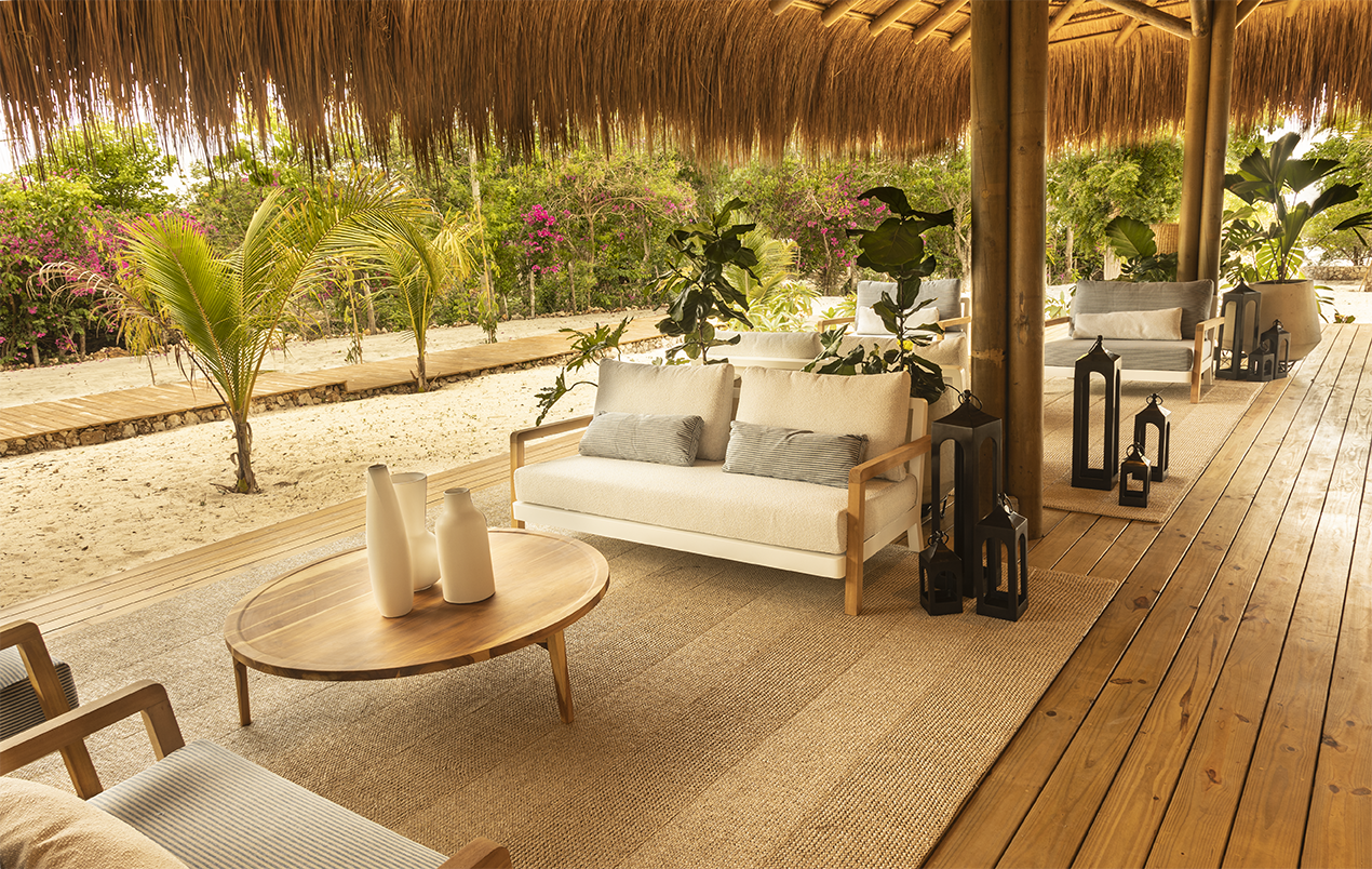 a patio with a white couch and a table