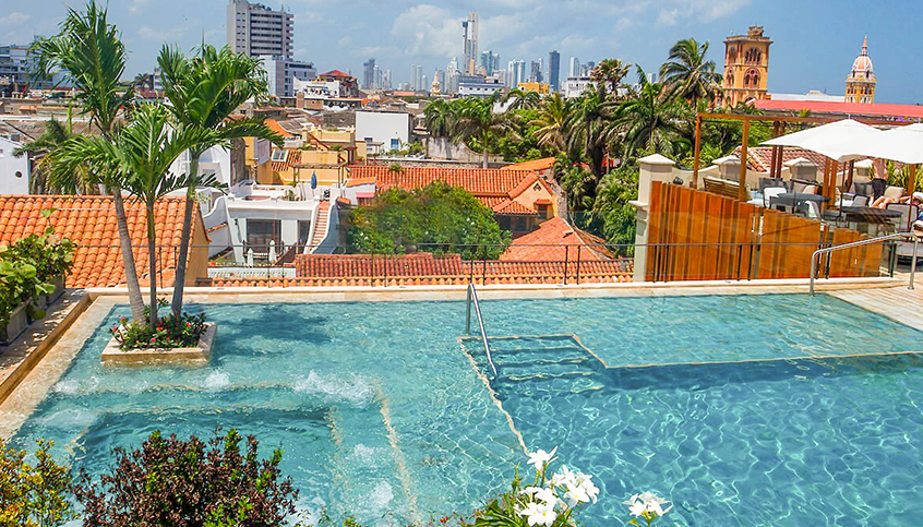 a pool with a city in the background