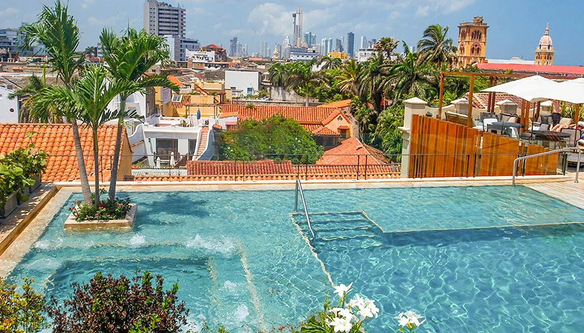 a pool with a city in the background