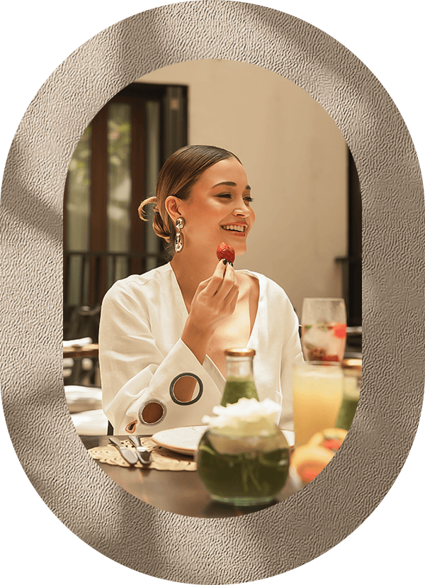 a woman eating a strawberry