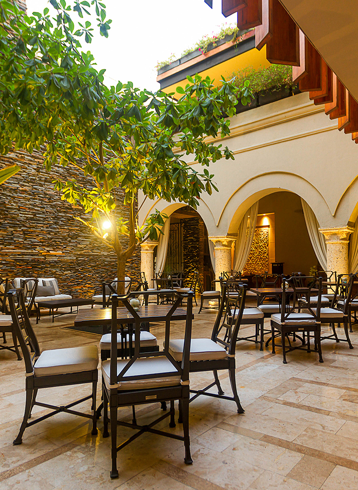 a patio with tables and chairs