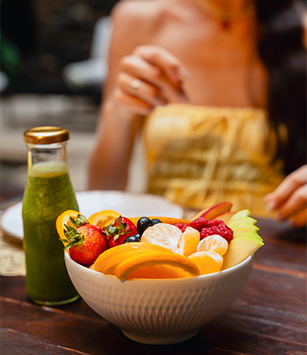 a bowl of fruit on a table