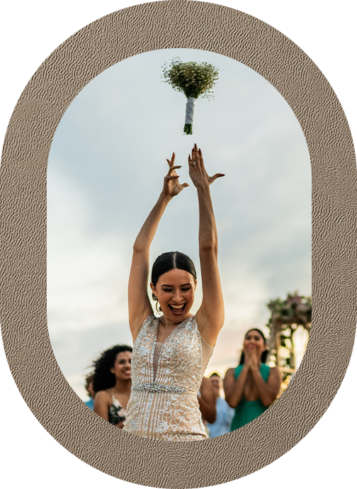 a woman throwing a bouquet of flowers