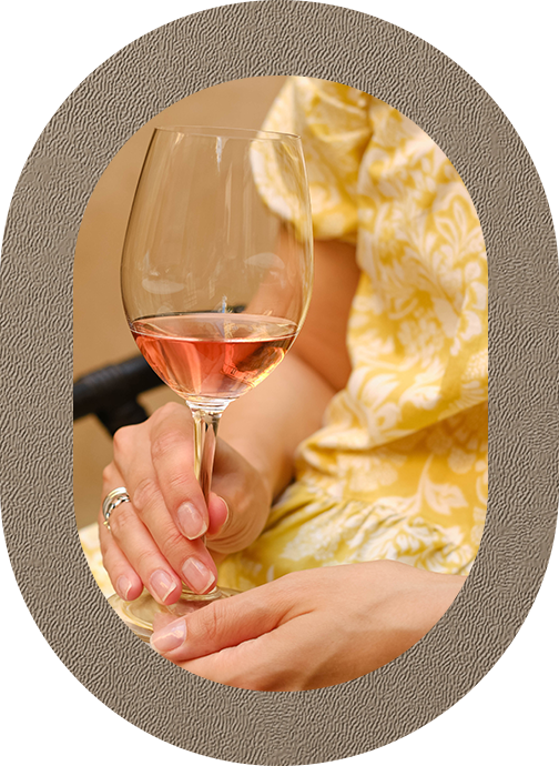 a woman holding a glass of wine